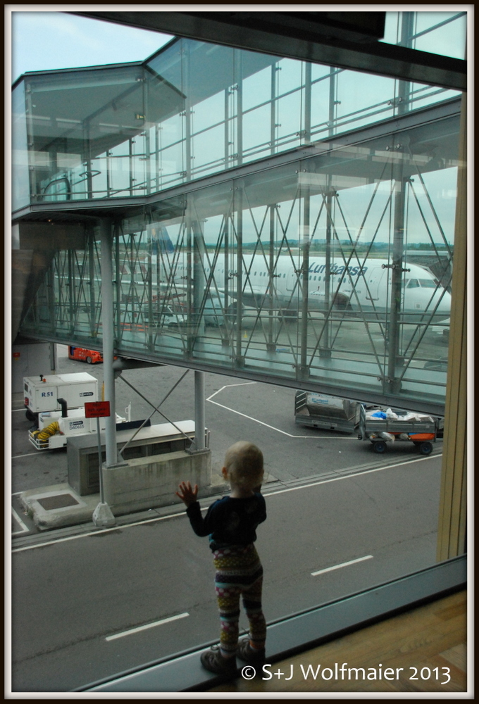 Our daughter enjoying the airport, it has so nice big windows to look out through.